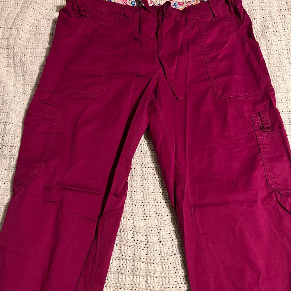 Maroon scrub pants.